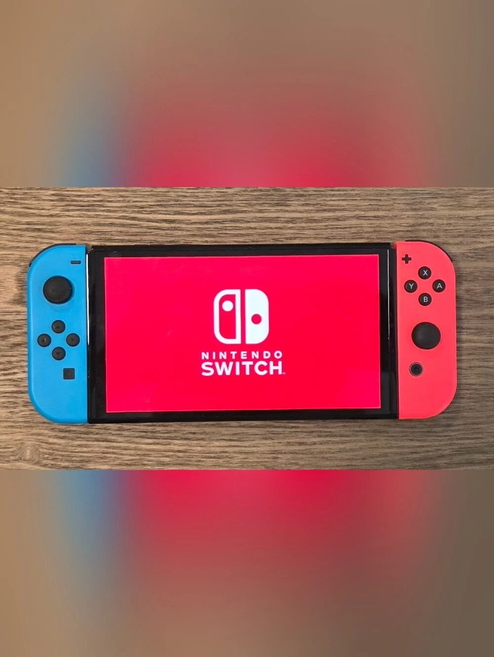Nintendo Switch OLED - Neon Blue/Neon Red Renewed